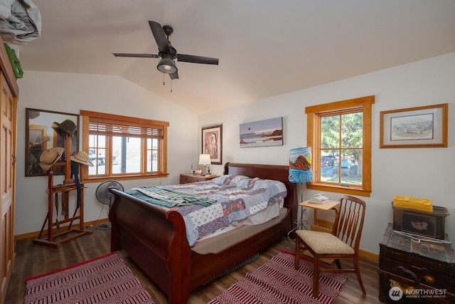 bedroom with ceiling fan, baseboards, vaulted ceiling, and wood finished floors