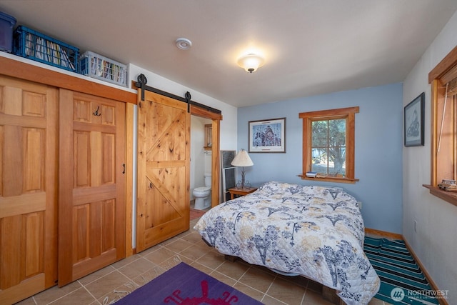 tiled bedroom with a barn door