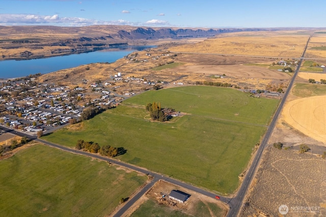 aerial view featuring a water and mountain view