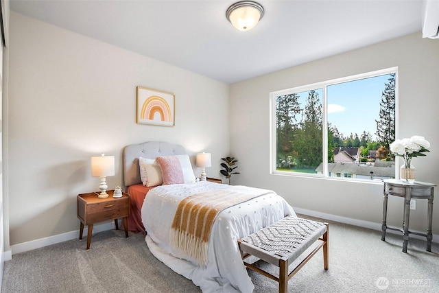 carpeted bedroom with baseboards
