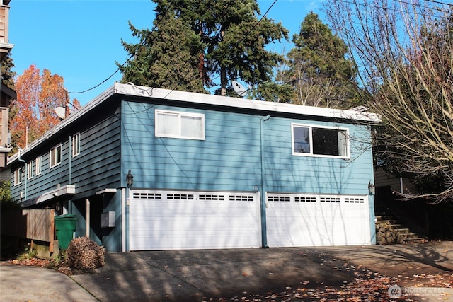 110 NW 39th St, Seattle, WA 98107 - view of front of property with concrete driveway and an attached garage
