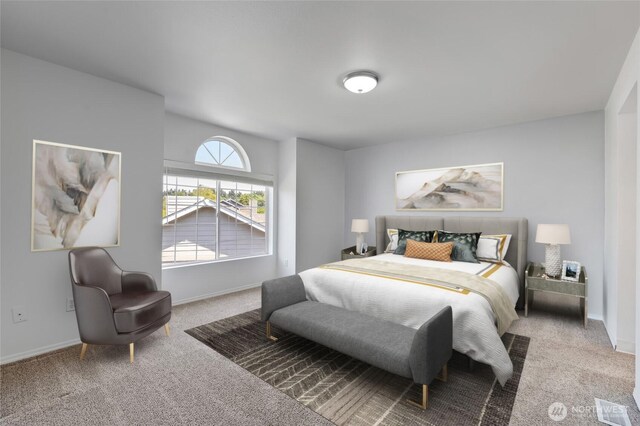 bedroom featuring carpet flooring and baseboards