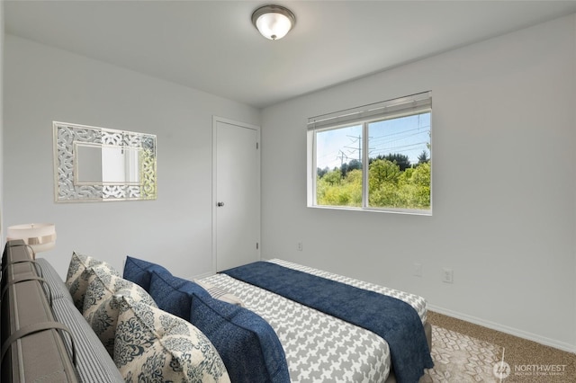 carpeted bedroom with baseboards