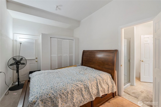 bedroom featuring light colored carpet and baseboards
