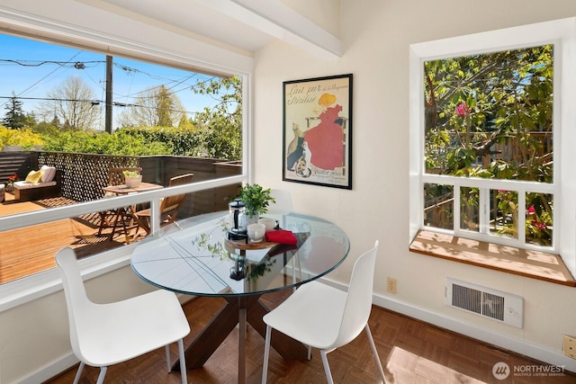 dining area featuring visible vents and baseboards