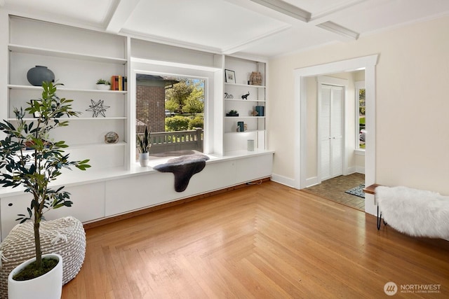 mudroom featuring baseboards, coffered ceiling, and beam ceiling