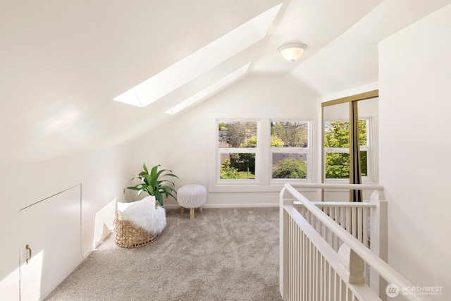 bonus room with carpet floors, a wealth of natural light, and lofted ceiling with skylight