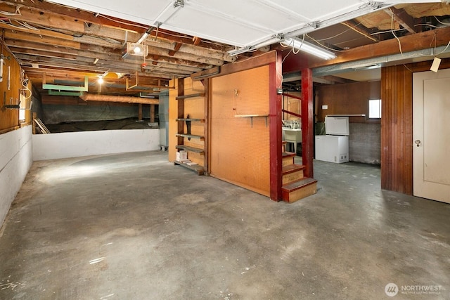 below grade area with a sink and refrigerator