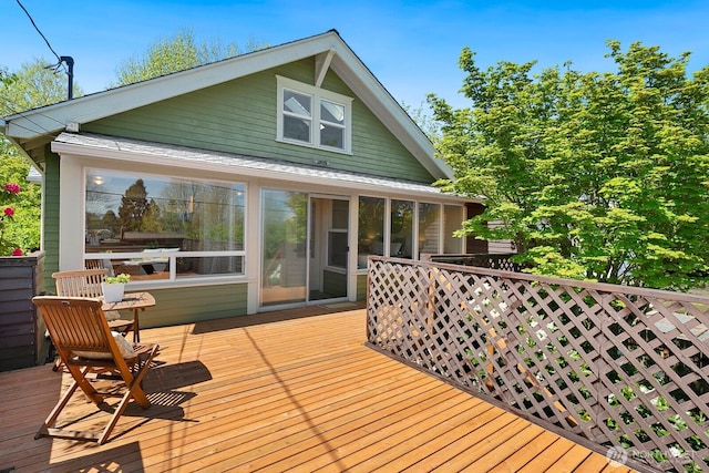 deck with a sunroom