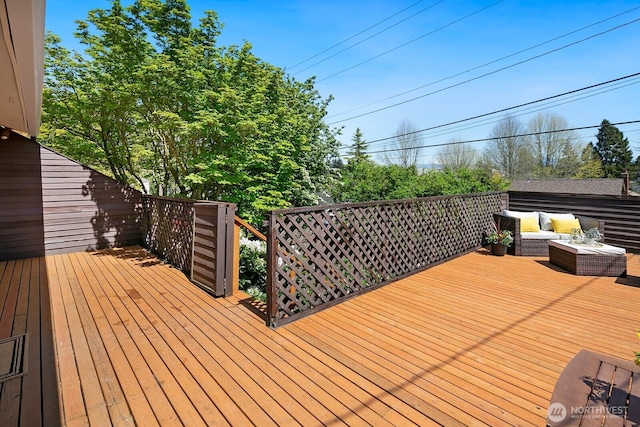 wooden deck featuring outdoor lounge area