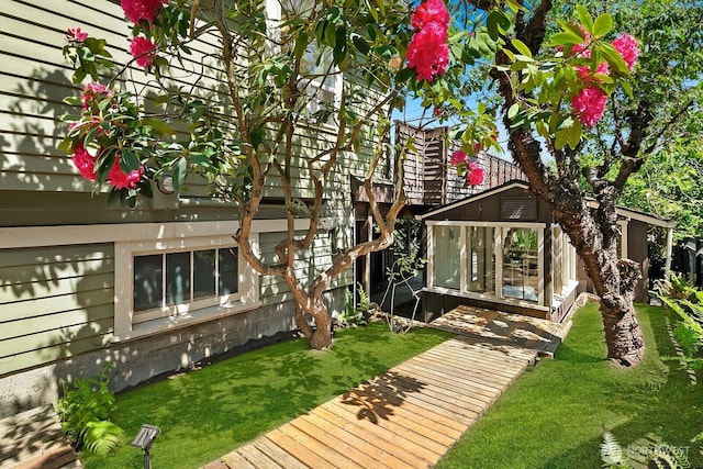 rear view of property with a lawn