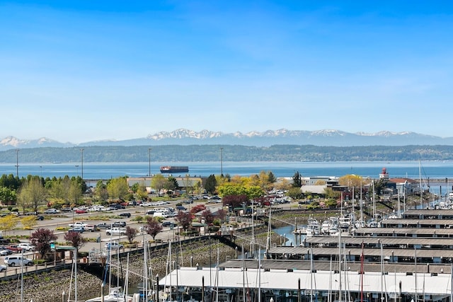 birds eye view of property featuring a water and mountain view