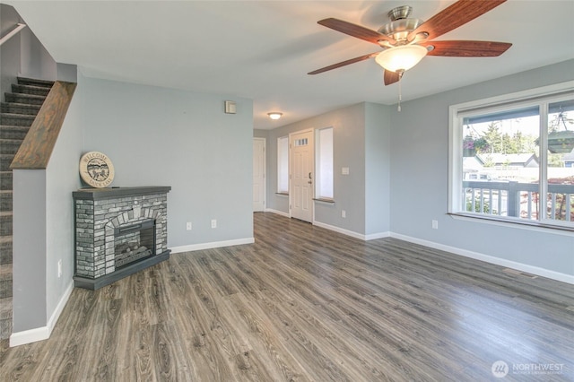 293 Glacier Ct SE, Ocean Shores, WA 98569 - unfurnished living room with a ceiling fan, stairs, wood finished floors, and visible vents