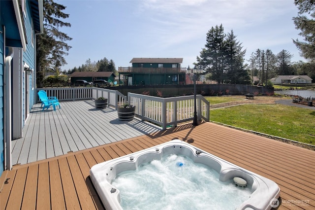 293 Glacier Ct SE, Ocean Shores, WA 98569 - wooden deck with a lawn, hot tub deck surround, and fence