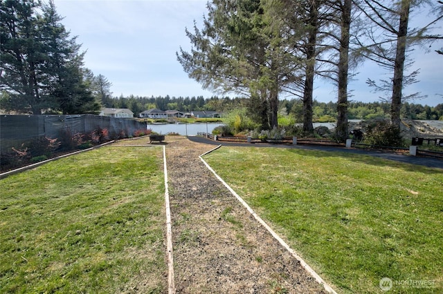 293 Glacier Ct SE, Ocean Shores, WA 98569 - view of yard featuring a water view and fence