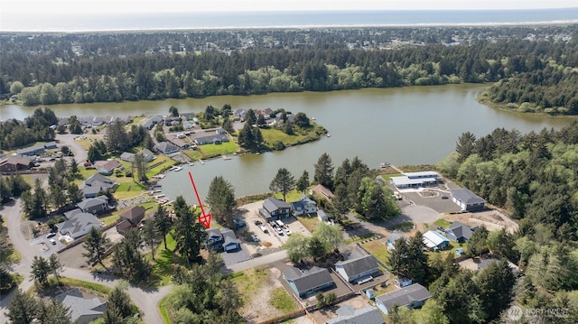 293 Glacier Ct SE, Ocean Shores, WA 98569 - birds eye view of property with a water view, a residential view, and a forest view