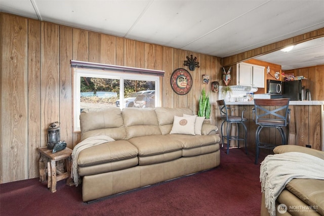 51 N Old Mill Hill Rd, Hoodsport, WA 98548 - living room featuring wood walls and carpet floors