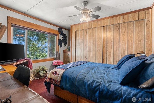 51 N Old Mill Hill Rd, Hoodsport, WA 98548 - carpeted bedroom with wooden walls and ceiling fan