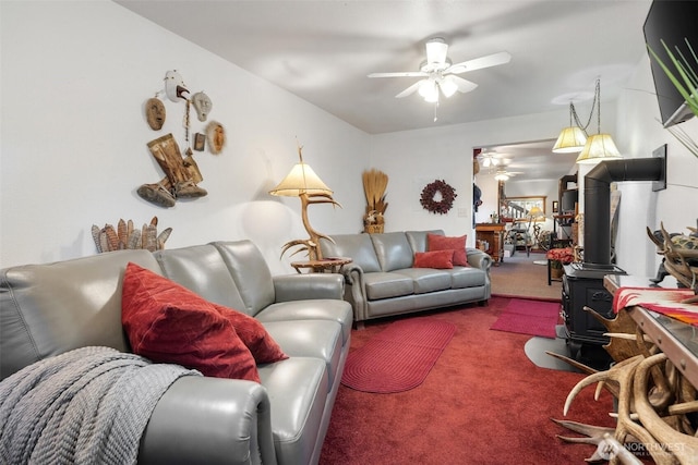51 N Old Mill Hill Rd, Hoodsport, WA 98548 - carpeted living area featuring a ceiling fan and a wood stove