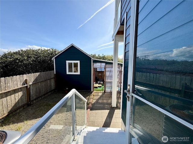 1160 Greenview Ave SW, Ocean Shores, WA 98569 - view of patio featuring a shed and an outdoor structure