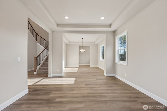 10603 134th Ave NE Unit 102, Lake Stevens, WA 98258 - interior space with an inviting chandelier, baseboards, stairway, and a tray ceiling