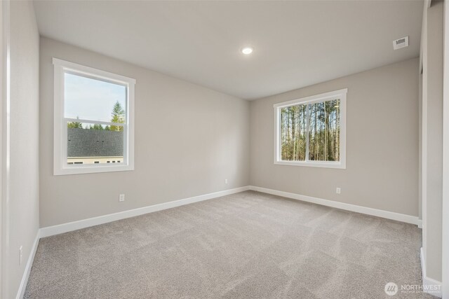 10603 134th Ave NE Unit 102, Lake Stevens, WA 98258 - carpeted empty room featuring visible vents, recessed lighting, and baseboards