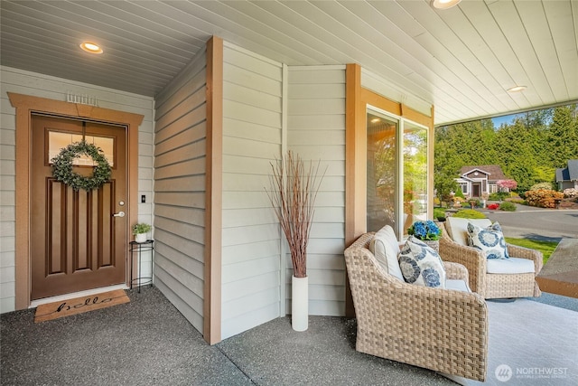 doorway to property with covered porch