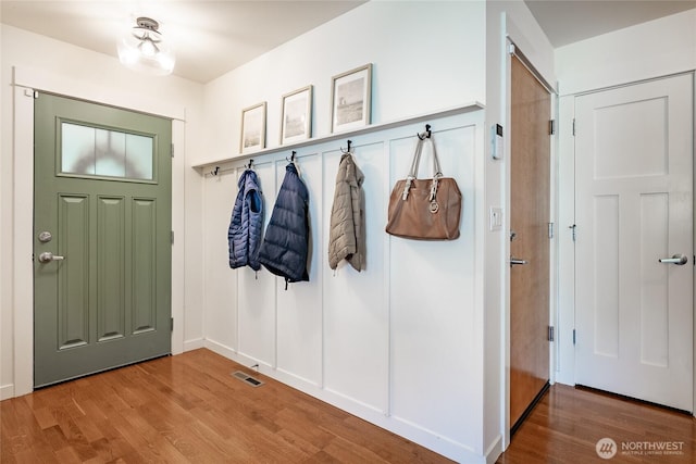 mudroom with visible vents and wood finished floors