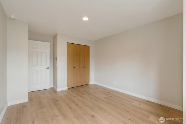 16820 6th Ave W Unit A4, Lynnwood, WA 98037 - unfurnished bedroom featuring light wood-style flooring, baseboards, a closet, and recessed lighting