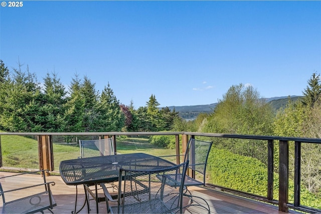 wooden deck with outdoor dining space