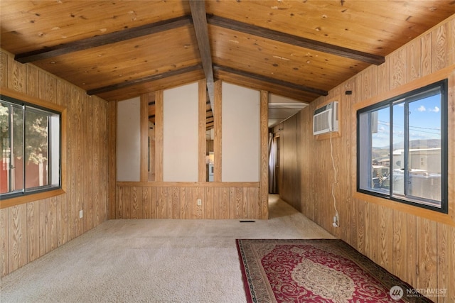 carpeted spare room with wood walls, wooden ceiling, a healthy amount of sunlight, and a wall mounted air conditioner