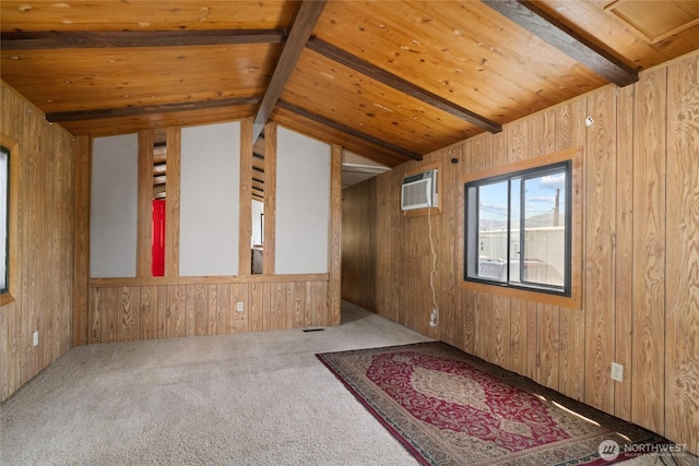 carpeted empty room featuring wood walls, wood ceiling, lofted ceiling with beams, and a wall mounted air conditioner