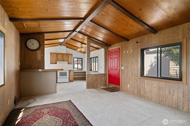 unfurnished living room featuring wooden walls, lofted ceiling with beams, wooden ceiling, and light carpet