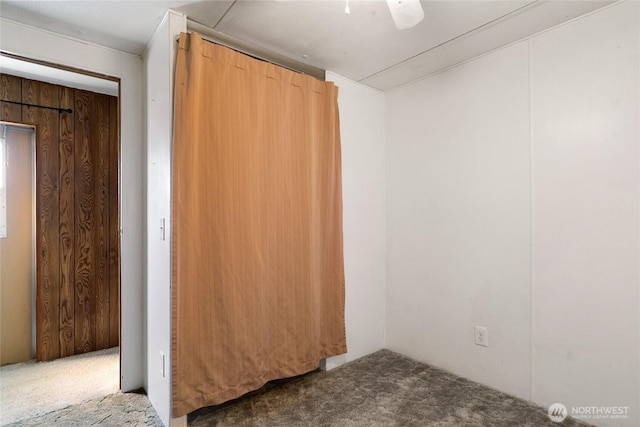 unfurnished bedroom featuring carpet floors and a ceiling fan
