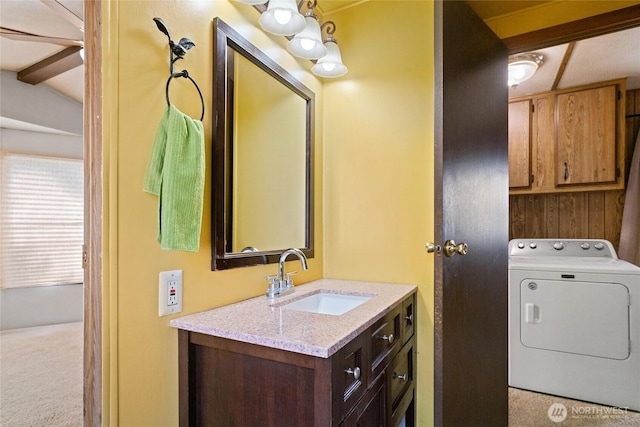 interior space featuring vanity and washer / dryer