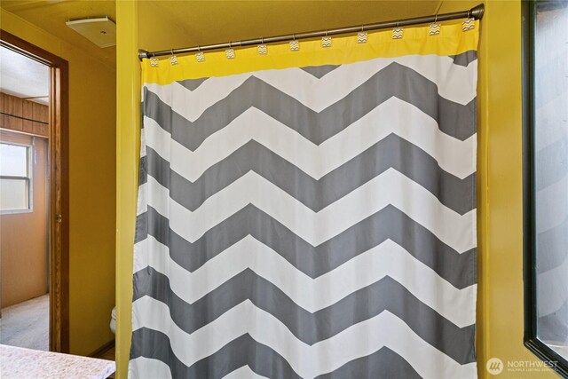 full bathroom with a shower with shower curtain