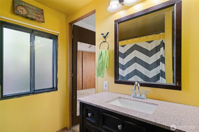 full bathroom with vanity and curtained shower