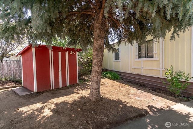 view of shed with fence