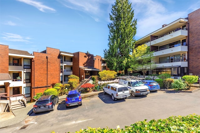 view of property featuring uncovered parking