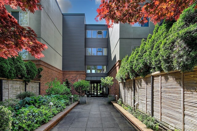 surrounding community featuring fence and a patio