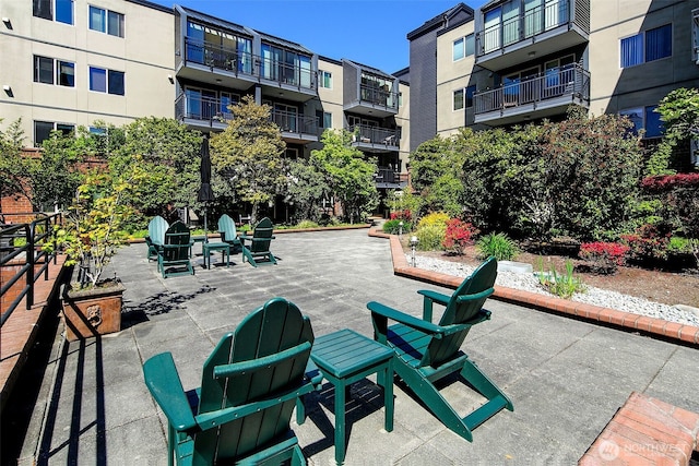 view of property's community with a patio area
