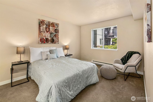 carpeted bedroom featuring baseboards and a baseboard heating unit