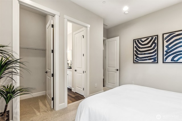 10619 132nd Ave NE Unit 101, Lake Stevens, WA 98258 - carpeted bedroom featuring baseboards and a closet