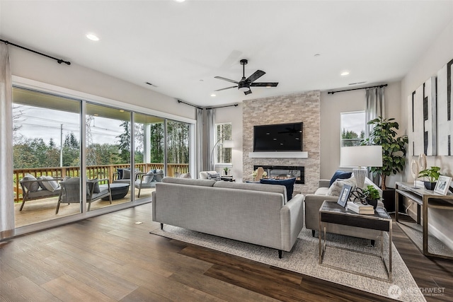 10619 132nd Ave NE Unit 101, Lake Stevens, WA 98258 - living area featuring plenty of natural light, ceiling fan, a fireplace, recessed lighting, and dark wood-style flooring
