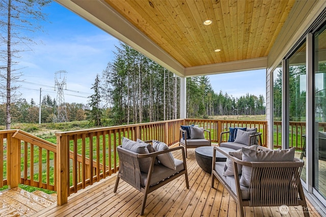 10619 132nd Ave NE Unit 101, Lake Stevens, WA 98258 - wooden terrace featuring outdoor lounge area and view of wooded area