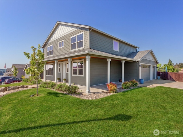 904 E Tanoak Ave, La Center, WA 98629 - view of front of home with a garage, concrete driveway, and covered porch