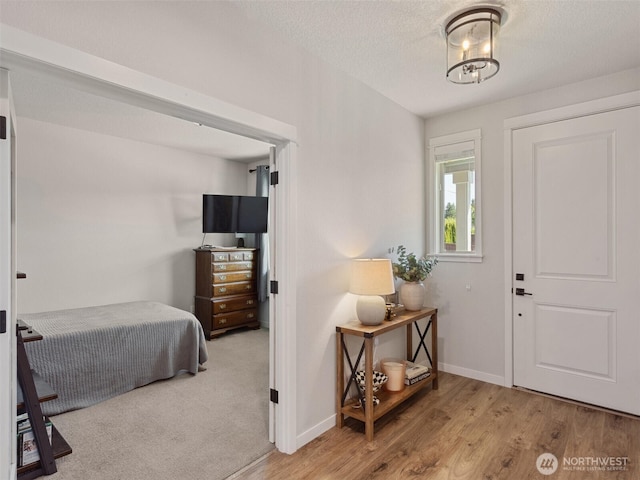 904 E Tanoak Ave, La Center, WA 98629 - foyer entrance with wood finished floors, baseboards, and a textured ceiling