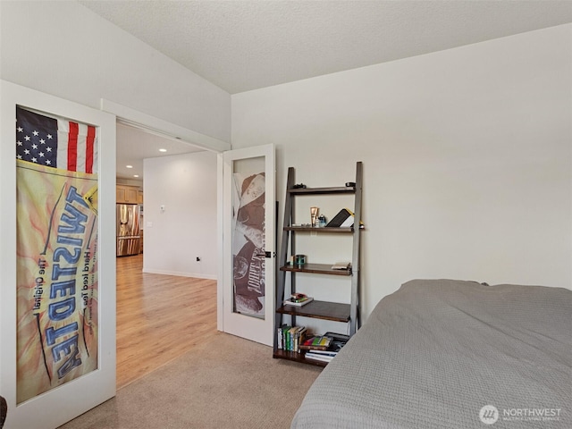 904 E Tanoak Ave, La Center, WA 98629 - bedroom with stainless steel fridge, recessed lighting, and light colored carpet