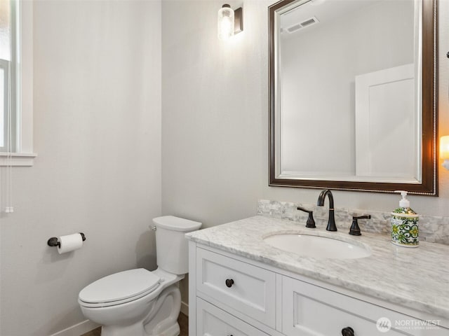 904 E Tanoak Ave, La Center, WA 98629 - half bathroom with baseboards, toilet, and vanity