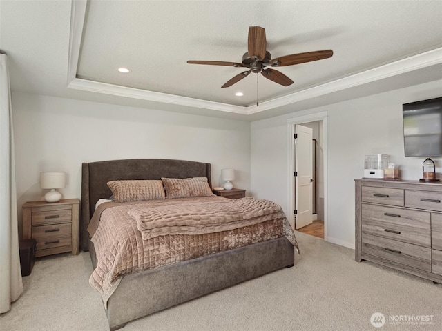 904 E Tanoak Ave, La Center, WA 98629 - bedroom featuring a tray ceiling, light colored carpet, recessed lighting, a ceiling fan, and ornamental molding